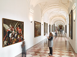 DomQuartier Salzburg - Visitors in the long gallery St. Peter with paintings