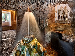 Hellbrunn Palace & Trick Fountains - The Crown Grotto with a jet of water lifting a crown