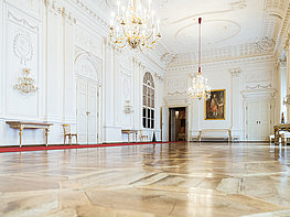 DomQuartier Salzburg - White Hall with chandeliers and wall reliefs