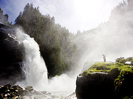 Krimml Worlds of Water - Woman in front of the impressive Krimml Waterfalls