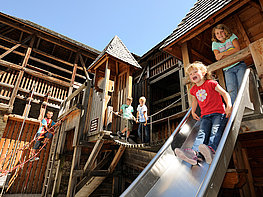 Mauterndorf Castle - children at the playground in the castle courtyard